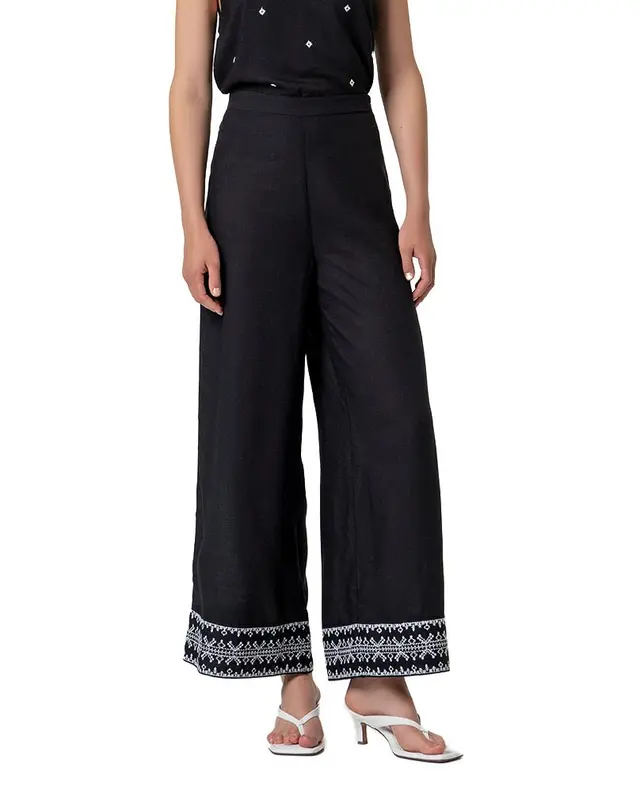 Pantalone ampio nero ricami bianchi